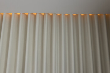 Ripple fold or S fold blackout curtain-drapery and cove light.