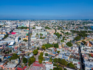 Fototapeta premium Beautiful aerial view of the City of San Domingo, its buildings and Caribbean ocean, in Dominican Republic