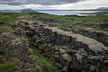 Fototapeta na wymiar Rift in lava rock formations near Thingvellir National Park in Iceland