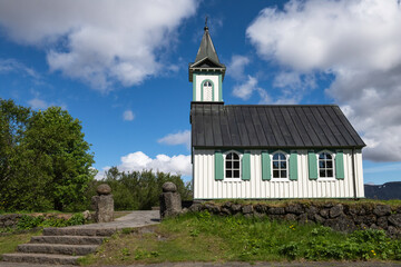 Fototapeta na wymiar Icelandic church in Thingvellir National Park, a UNESCO World Heritage-listed. Dating back to 1859, Thingvellir church is originally called Þingvallakirkja. 
