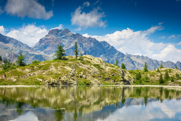 Fototapeta na wymiar Reflection of the Mount Avic Lake, Aosta Valley, Italy