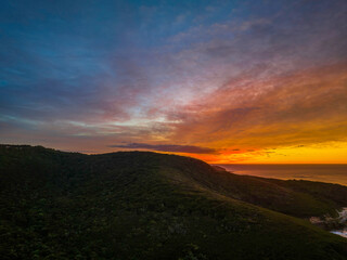 High cloud sunrise over the mountain and sea