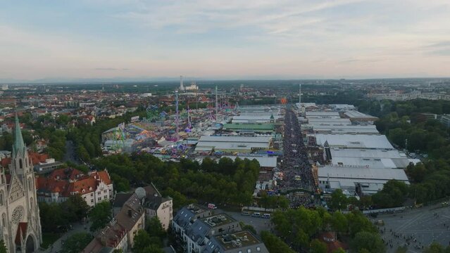 Amazing aerial footage of Oktoberfest site with high capacity beer tents and adrenaline attractions in amusement park. Munich, Germany