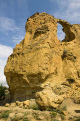 A large stone rock with a round hole - Mount ring in Kislovodsk Russia on a sunny summer day and a space for copying