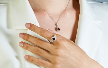 Diamond jewelry. Diamond ring ant necklace on woman