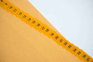 close up of numerical tab dividers on blank paper