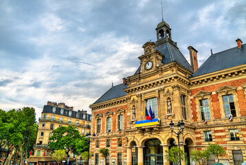 City hall of XIX arrondissement with Ukrainian Flags in Paris, France - obrazy, fototapety, plakaty