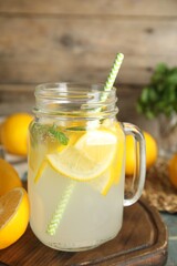 Cool freshly made lemonade in mason jar on table
