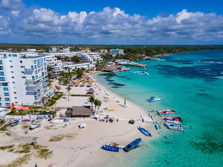 Beautiful aerial view of Boca Chica beach, its turquoise waters, resorts near the Santo Domingo Airport in Dominican Republic