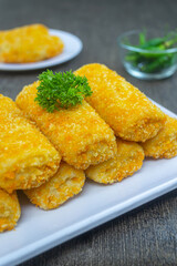 Risoles bihun or rissole with vermicelli noodle filling served on white plate. snacks that are cooked by frying, have a savory taste