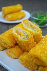 Risoles bihun or rissole with vermicelli noodle filling served on white plate. snacks that are cooked by frying, have a savory taste