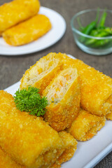 Risoles bihun or rissole with vermicelli noodle filling served on white plate. snacks that are cooked by frying, have a savory taste
