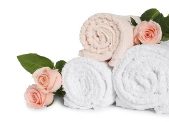 Obraz na płótnie Canvas Clean soft towels with flowers isolated on white