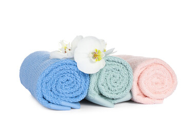 Obraz na płótnie Canvas Clean soft towels with orchids isolated on white