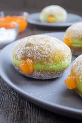 bomboloni pandan sarikaya or Bombolone doughnut. A bombolone is an Italian filled doughnut and is eaten as a snack food and dessert. It has a soft texture and has a sweet and savory taste