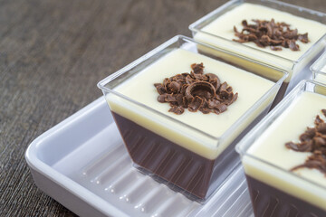 puding coklat vla susu or chocolate pudding with vla milk sauce, Chocolate pudding is one of the desserts, made from chocolate, milk, sugar and other ingredients, has a soft texture and sweet taste.