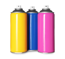 Colorful cans of spray paints on white background