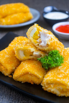 risol mayo or mayonnaise risole. food containing boiled eggs, sausage and mayonnaise sauce wrapped in risole skin and breadcrumbs, cooked by frying. has a savory taste