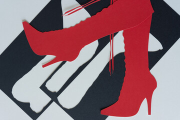 dingbat silhouette cutout of red stiletto boots with laces and stencil cutout of boots - obrazy, fototapety, plakaty