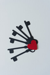 dingbat silhouette cutout of vintage keys and wooden heart painted red