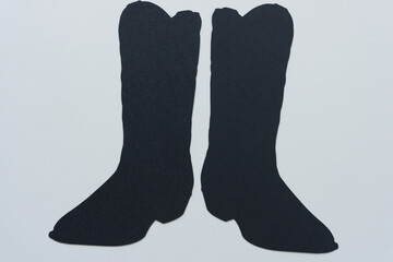 dingbat silhouette cutout of two boots