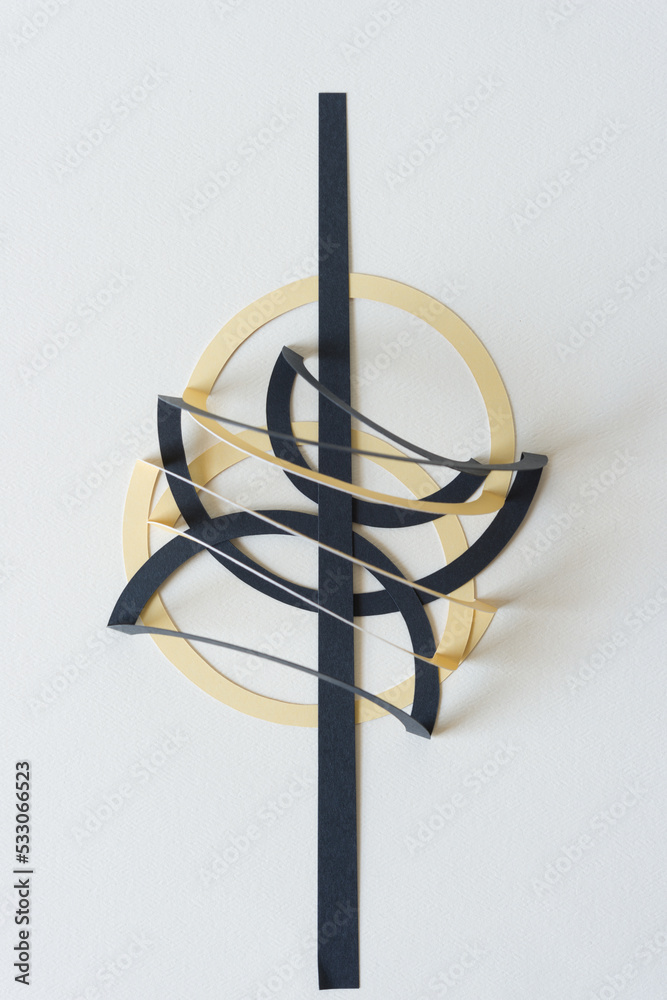 Canvas Prints folded black and yellow paper rings with black line on blank paper