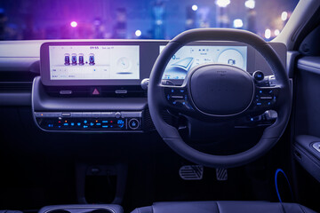 Dashboard electric car with glowing city
