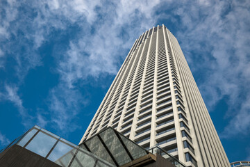 Fototapeta na wymiar Modern apartment building against blue sky background