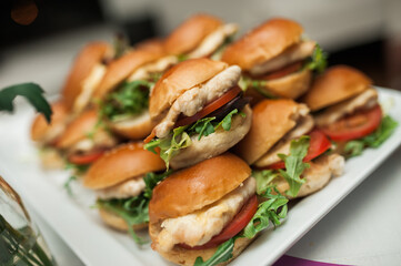 Photo of delicious tasty mini hamburgers