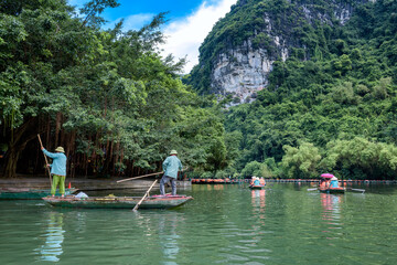 Workers clean up the river environment in Trang An, Ninh Binh province, Vietnam.
