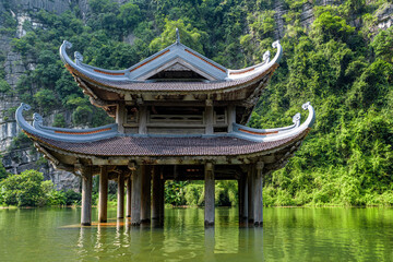 The ancient pagoda is located on the river in Trang An, Ninh Binh province, Vietnam