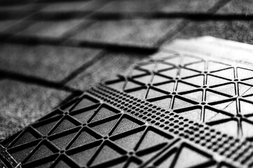 Underside of a synthetic roof shingle that is hail and wind resistant. 