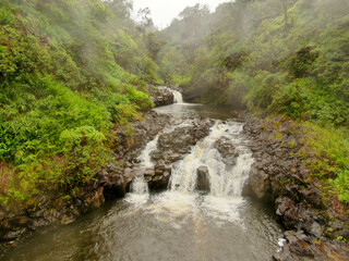 Fototapeta na wymiar Waterfall along the road to Hana on the Hawaiian Island of Maui 2