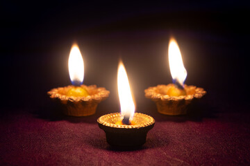 Clay diya lamps lit during diwali celebration. Indian festival diwali