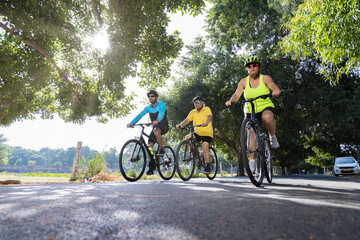 Naklejka premium Confident cyclists riding bicycle on countryside road 