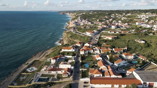 Aerial view of Azenhas do Mar, a small township along the wild Portuguese coastline facing the Atlantic Ocean, Colares, Portugal.