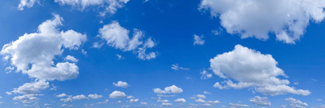 Panorama of a blue sky with white clouds