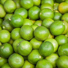 Limes close-up on background in supermarket