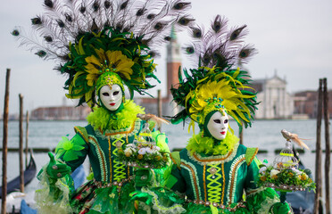 the bright colors of the costumes of the Carnival in Piazza S Marco in Venice