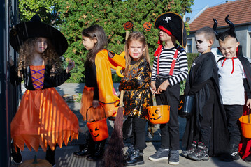 Today's day is full of fun. Happy group of kids on Halloween  