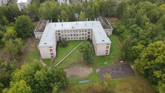 Picturesque view on school in green trees