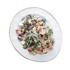 Top view on greek salad dressed with mayonnaise