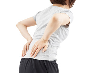 白背景で痛む腰を押さえる女性
