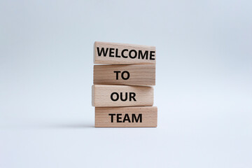 Welcome to our team symbol. Concept words Welcome to our team on wooden blocks. Beautiful white background. Business and Welcome to our team concept. Copy space.
