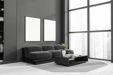 Dark living room interior with two empty white posters, sofa