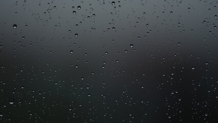 Real background of rain hitting glass with protective coating