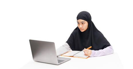 A Muslim girl uses a laptop computer for online learning.