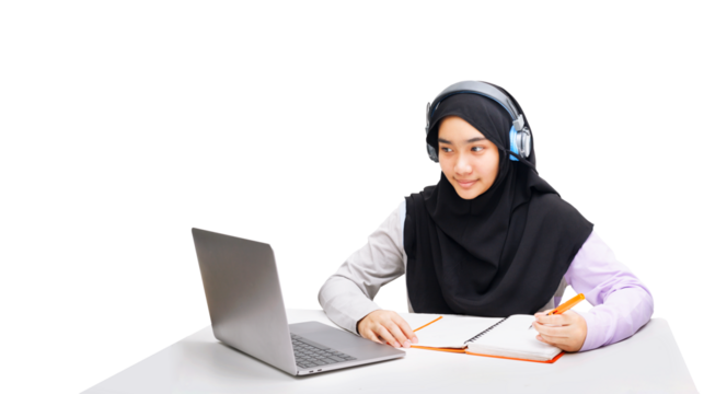 A Muslim girl uses a laptop computer for online learning.