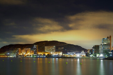 Alicante at night from Albufera beach, Valencian community in Spain. - 533104124