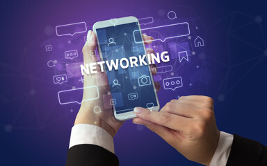 Hand using smartphone with social media concept